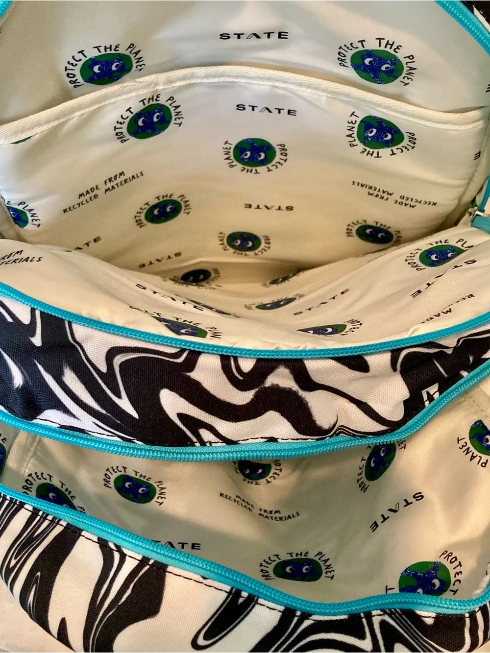 NWT Kane kids double pocket backpack in “paint wave” or “Marbled” print